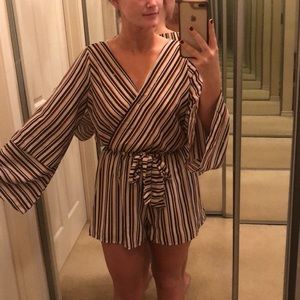 Striped romper with bell sleeves and tie at waist